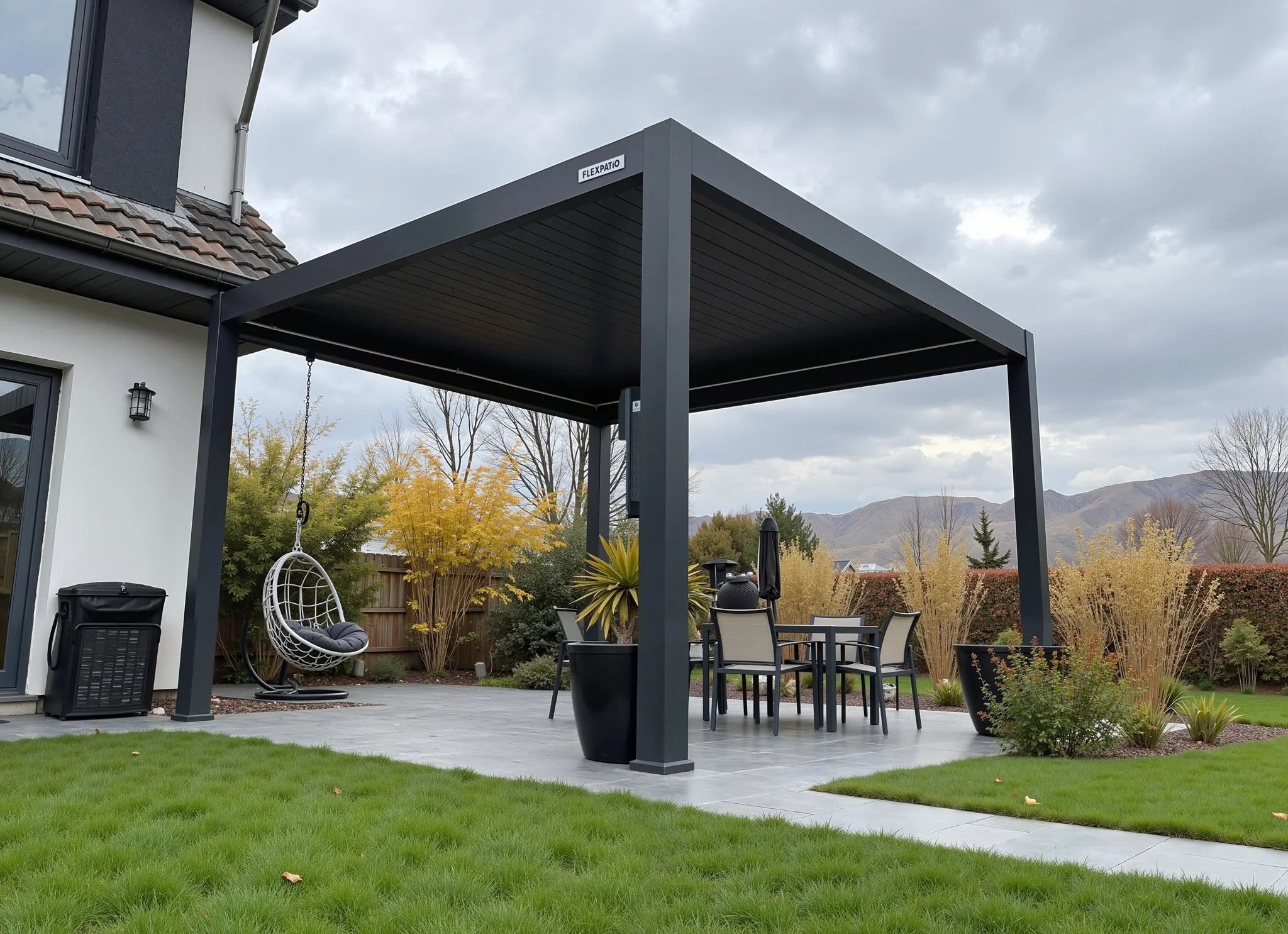 Black aluminum pergola with louvered roof over gray composite patio, steel posts, outdoor furniture